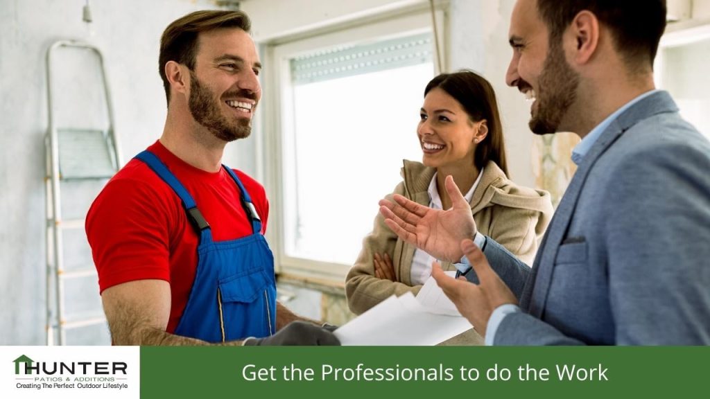 Smiling contractor discussing home renovation plans