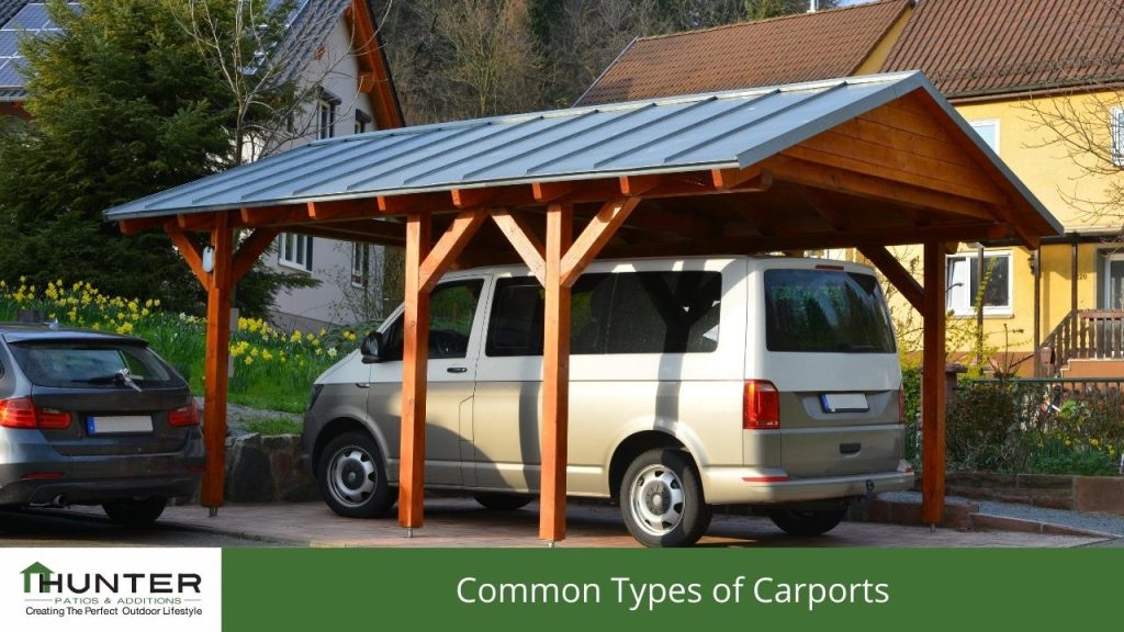 Common Types of Carports - Photo of a freestanding carport in a driveway.